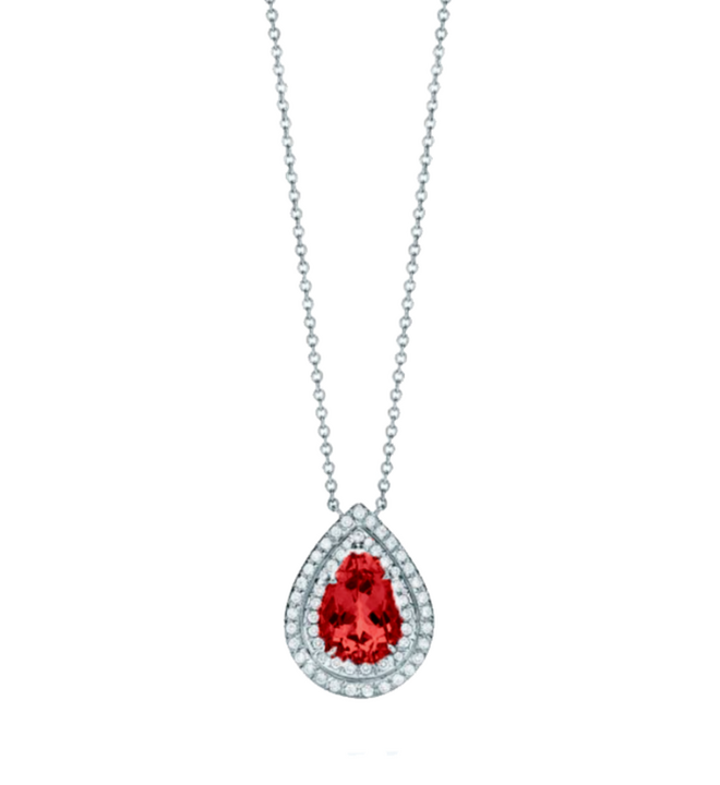 This necklace presents a 1.5-carat pear-shaped ruby as its focal point, encircled by a double halo of 0.3-carat round diamonds, set in high-quality white gold. The ruby&#39;s deep red hue contrasts beautifully with the sparkling diamonds, creating a bold and e