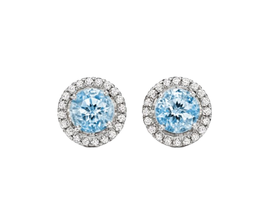 A 0.75-carat round-cut Aquamarine set in a double halo of 0.50-carat pavé diamonds. Crafted in 18K white gold with additional pavé diamonds on the band, bringing the total carat weight to 1.25.