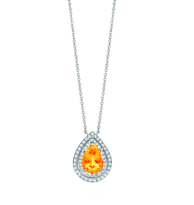 This necklace showcases a 1.5-carat pear-shaped mandarin garnet as its central stone, surrounded by a double halo of 0.3-carat round diamonds, all set in fine white gold. The garnet’s vibrant orange color contrasts beautifully with the diamonds, creating a