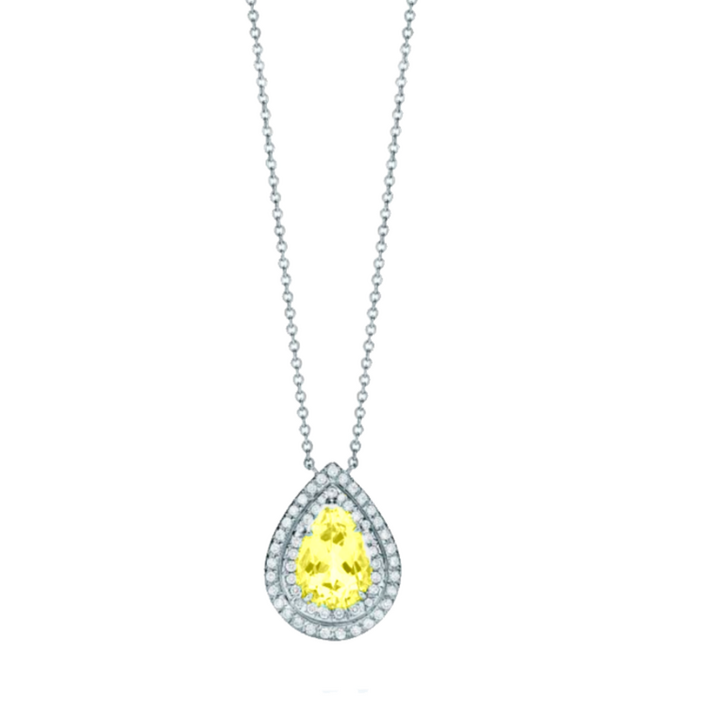 This necklace features a 1.5-carat pear-shaped topaz as the centerpiece, framed by a double halo of 0.3-carat round diamonds, crafted in high-quality white gold. The topaz’s bright hue is accentuated by the surrounding diamonds, creating a fresh and elegan