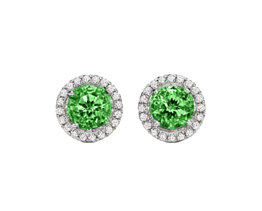 A 0.75-carat round-cut Emerald set in a double halo of 0.50-carat pavé diamonds. Crafted in 18K white gold with additional pavé diamonds on the band, bringing the total carat weight to 1.25.