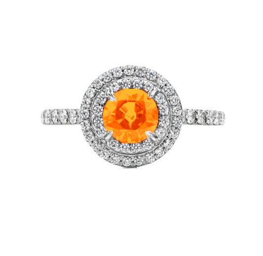 A 0.75-carat round-cut Mandarin Garnet set in a double halo of 0.50-carat pavé diamonds. Crafted in 18K white gold with additional pavé diamonds on the band, bringing the total carat weight to 1.25.