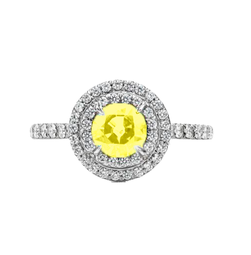 A 0.75-carat round-cut Topaz set in a double halo of 0.50-carat pavé diamonds. Crafted in 18K white gold with additional pavé diamonds on the band, bringing the total carat weight to 1.25.